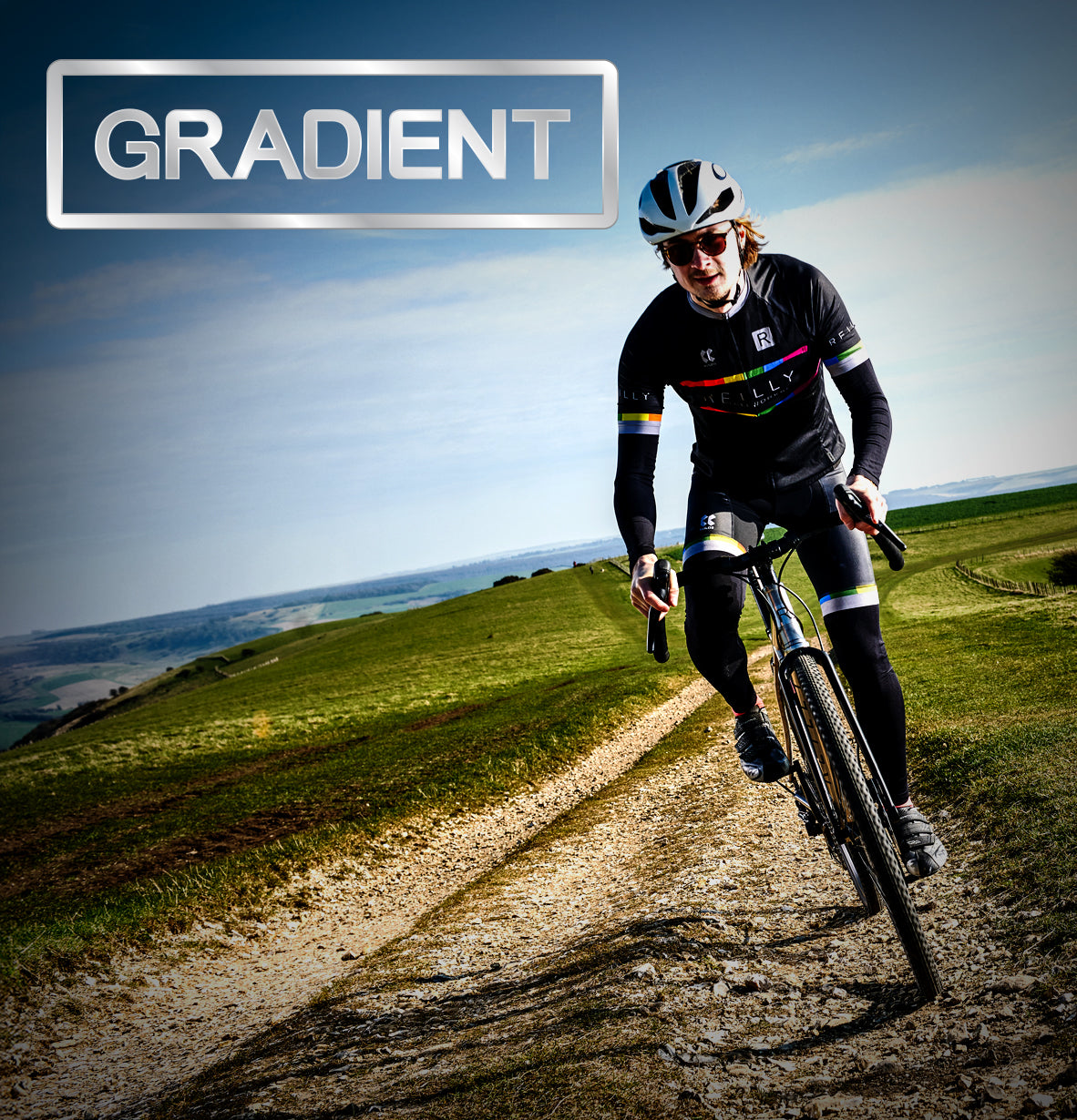 Man rides gravel bike, gravel path and green fields can be seen in the background. GRADIENT is written top left.