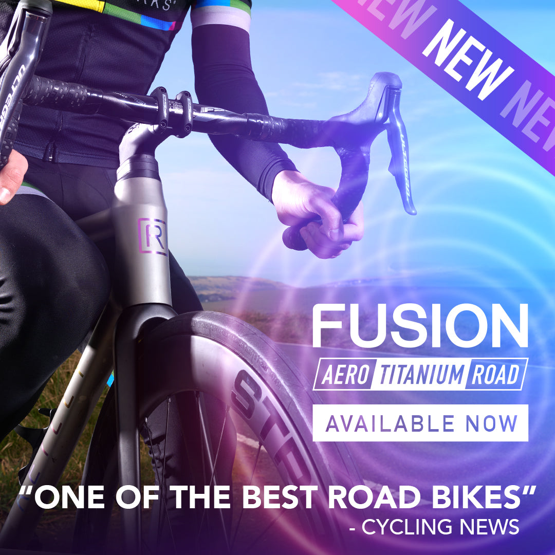 front of titanium road bike with clean cockpit,.  Graphics New Fusion Aero titanium Road with a quote from cycling news