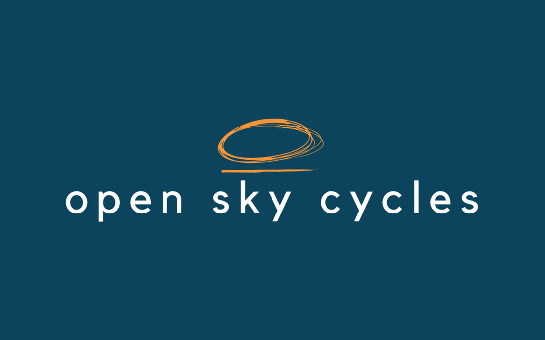 Open Sky Cycles with an orange oval drawn abot the word sky