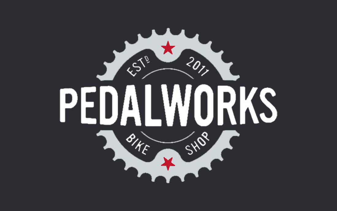 A bike cog with the word pedalworks written across the middle
