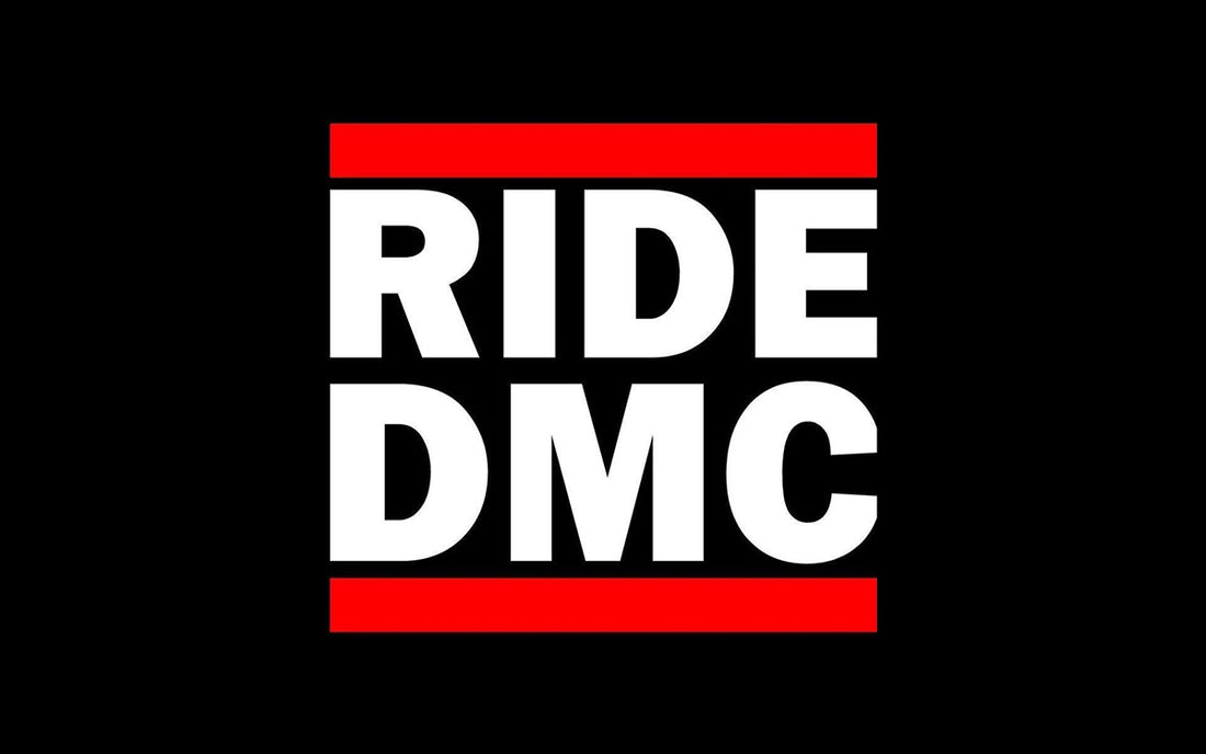 Black background with wording Ride DMC in white with red boarder top and bottom 