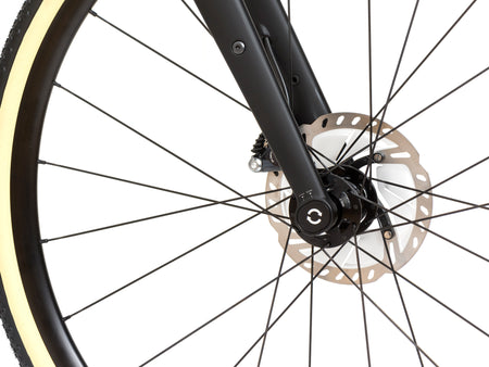 close up of the bottom of a Reilly adventure fork as it attaches to a wheel 