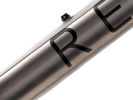 Close up of brushed titanium downtube with black decal.