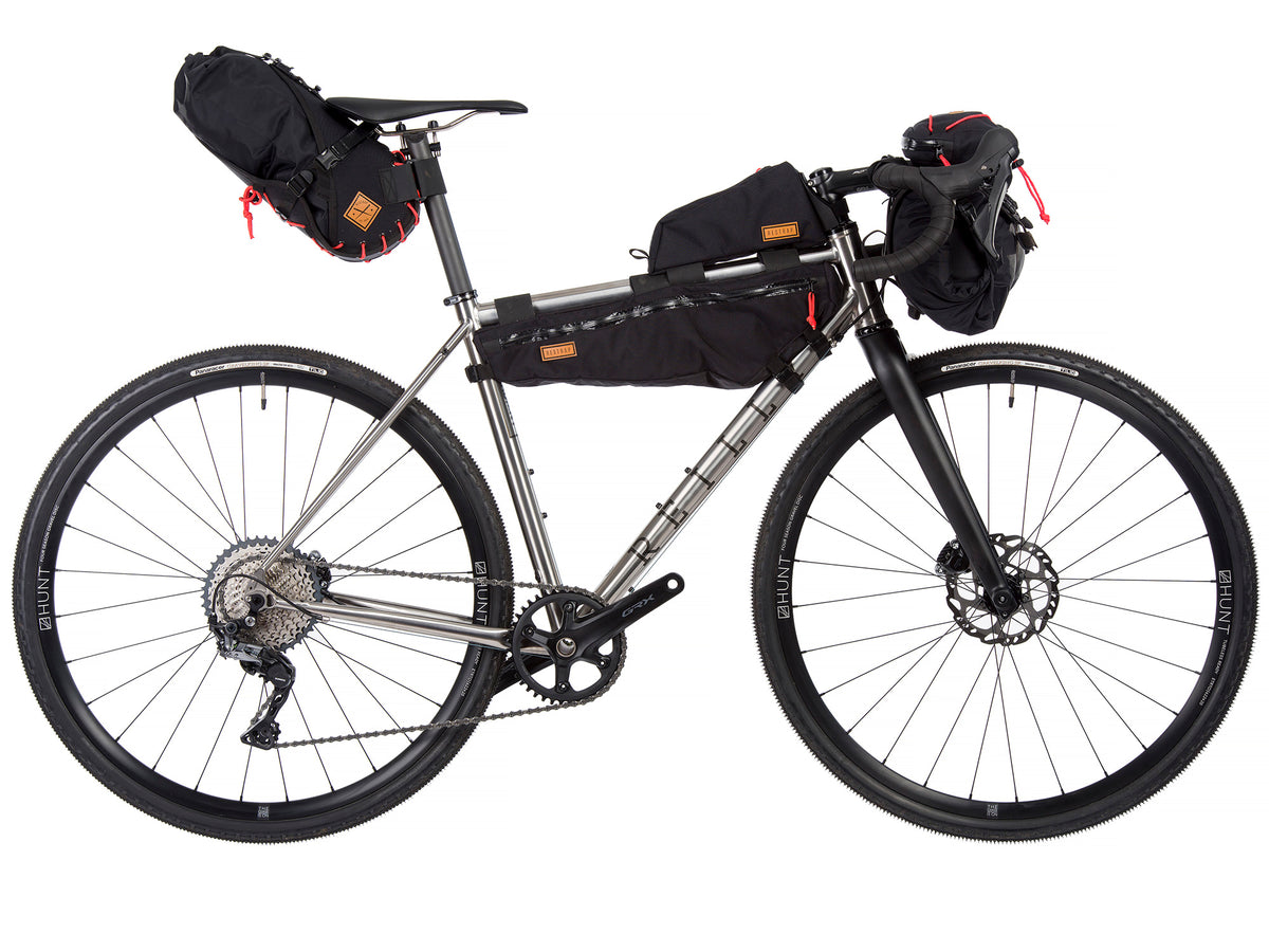Gravel Bike with bike packing kit loaded on to the bike.  handlebar bag, Top Tube bag and Seat post bag