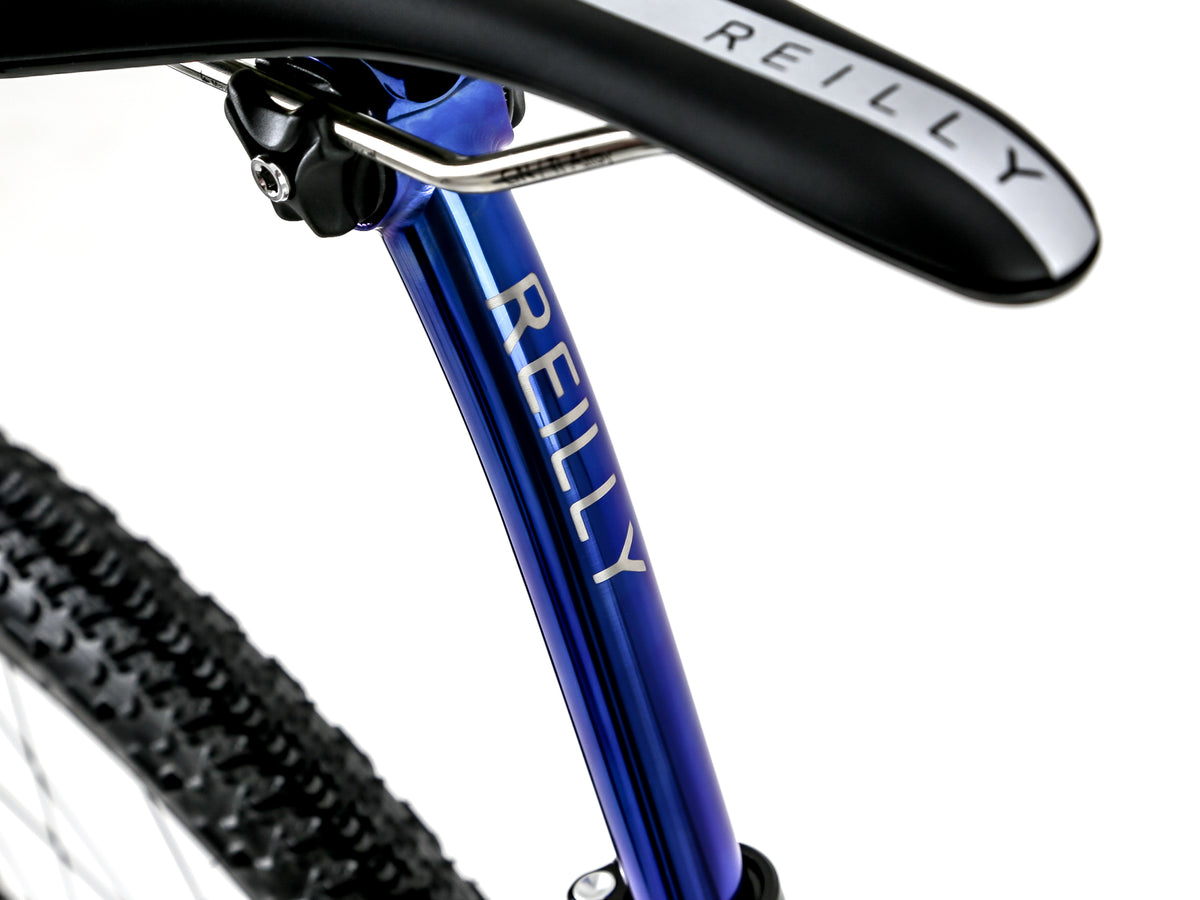 Blue anodised, titanium seat post with Reilly in brushed silver plus Reilly saddle. 