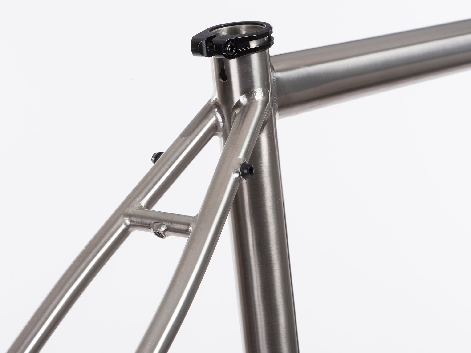 Brushed titanium seat post and close up of seat stays.