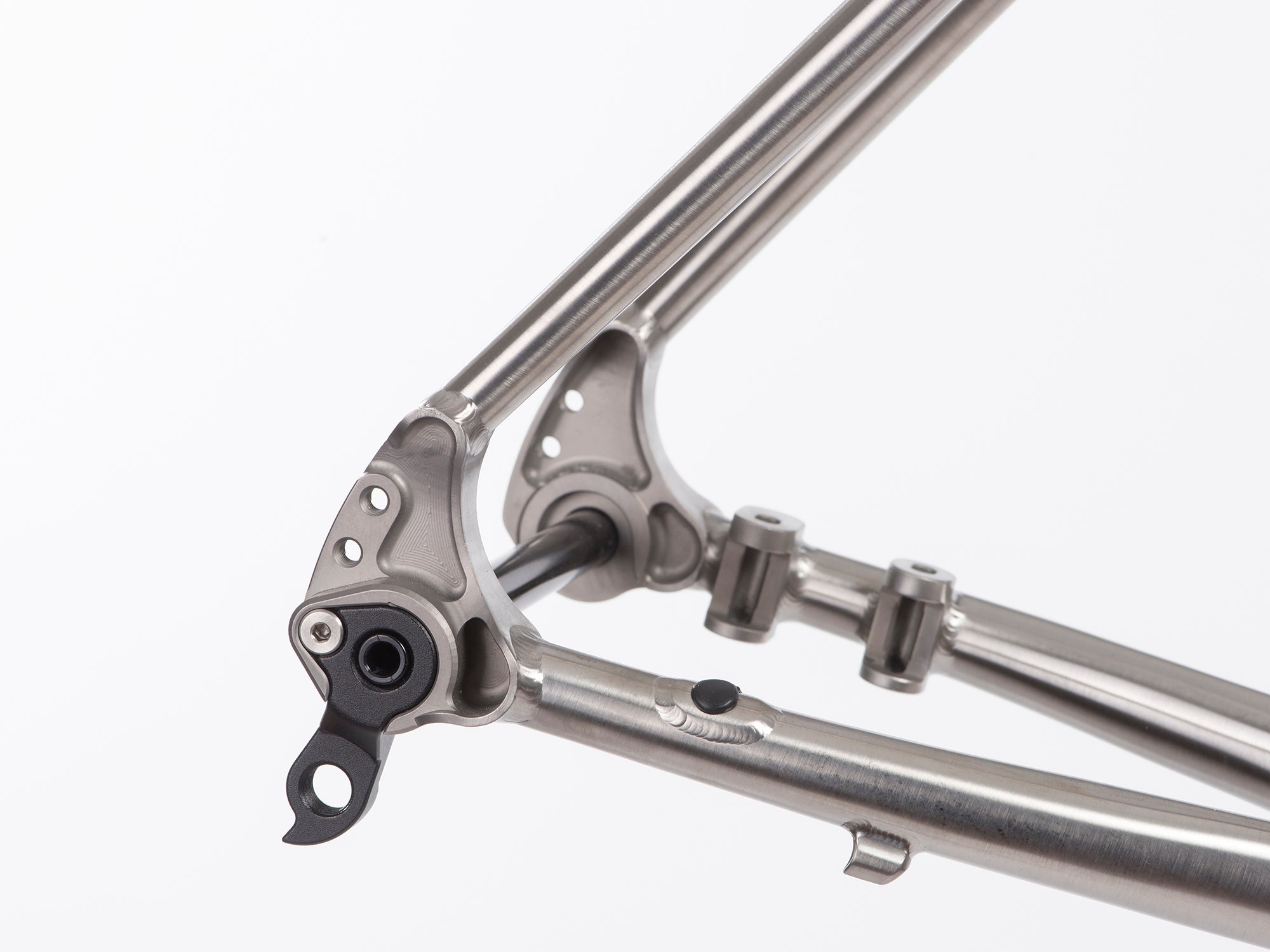 close up of titanium gravel frameset  to show the craftmanship.